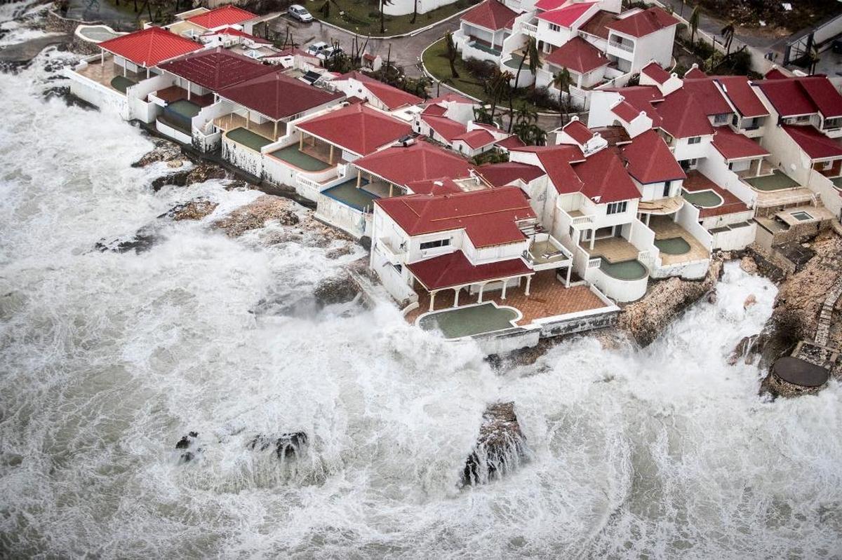This Sept. 6, 2017 photo provided by the Dutch Defense Ministry shows a few of the homes that remained intact in the aftermath of Hurricane Irma in St. Maarten. Irma cut a path of devastation across the northern Caribbean, leaving thousands homeless after destroying buildings and uprooting trees. Significant damage was reported on the island that is split between French and Dutch control.