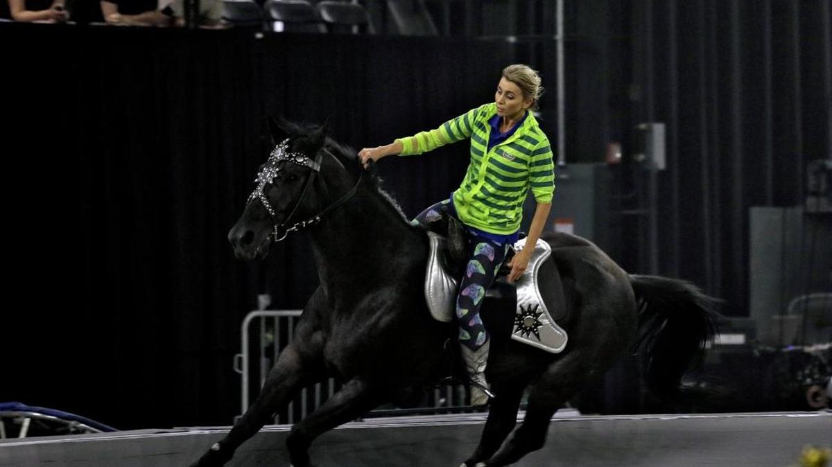 In this June 1, 2016 photo, Ringling Bros. and Barnum & Bailey Circus an entertainer rides a horse during a rehearsal for "Out of This World" Wednesday, June 1, 2016, in Palmetto. Now that Ringling Bros. and Barnum & Bailey has retired it's iconic elephants, executives under the big top say they must do more to draw a younger generation of fans, many of whom are glued to their smartphones and screens.