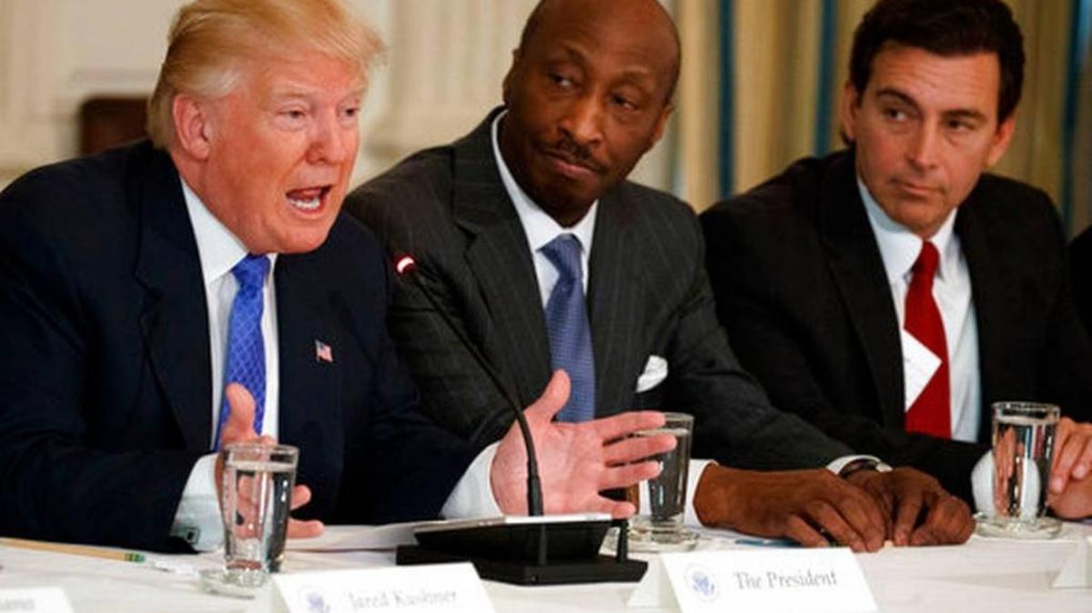 In this Feb. 23, 2017 photo, President Donald Trump, left, speaks during a meeting with manufacturing executives at the White House in Washington, including Merck CEO Kenneth Frazier, center, and Ford CEO Mark Fields.
