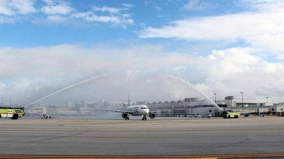 Water cannons salute a Frontier plane as it takes off from Miami International Airport on its inaugural flight to Havana on Dec. 1, 2016. The airline is canceling the route in June.