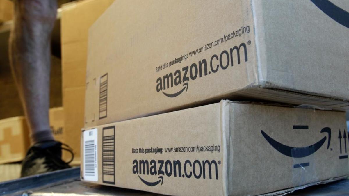 FILE - In this June 30, 2011 file photo, a United Parcel Service driver delivers packages from Amazon.com in Palo Alto, Calif. Amazon is offering deals July 12, 2016, for the second edition of its annual "Prime Day" promotion.