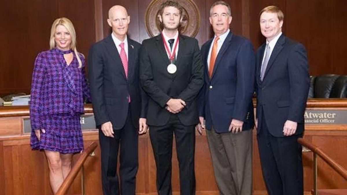 Sarasota business owner Nick O’Donnell receives Young Entrepreneur Award from Gov. Rick Scott Tuesday in Tallahassee.
