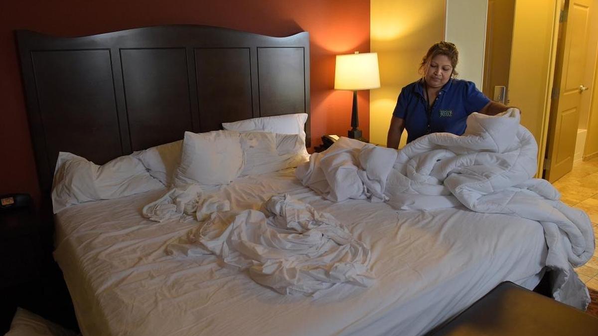 Rosy Quintanilla makes up a bed at the Hampton Inn and Suites in downtown Bradenton. Tuesday, the University of South Florida and the Sarasota-Bradenton hospitality industry are working together to address a job shortage in the area by hosting a job fair.