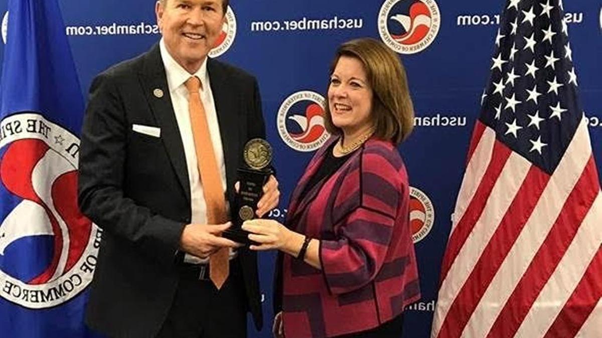 Rep. Vern Buchanan accepts the Spirit of Enterprise Award from Suzanne Clark, the senior executive vice president of the U.S. Chamber of Commerce.