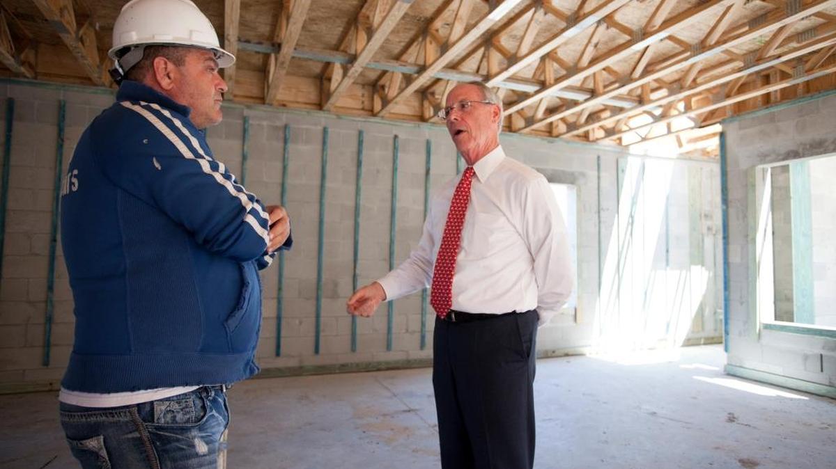 Pat Neal, chairman of Neal Communities, talks with a painting subcontractor working on one of his housing developments in Manatee County. His company moved up an annual homebuilder ranking published by Builder Magazine