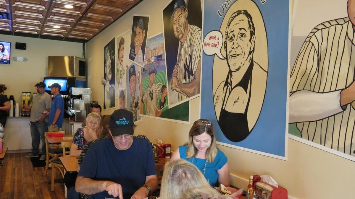 Customers dine on bagels and cream cheese on Monday at Uncle Nick’s N.Y. Style Bagels, Subs & Deli.