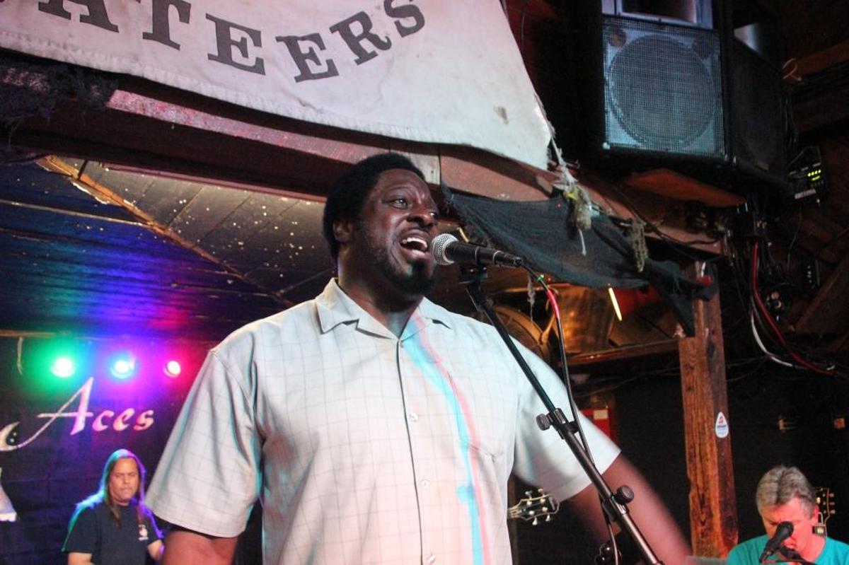 Former NFL player Henry Lawrence, a Palmetto native, sings during a recent benefit at Ace’s Live to raise money to repair the Anna Maria Island Privateers’ pirate ship, the Skullywag.