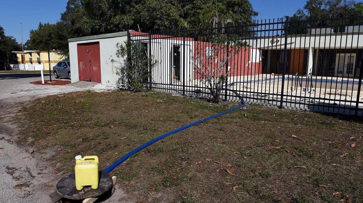 A hose empties green water from the pool into an opened sewer. City Walk apartments, 2019 5th St. W., sold for $6.5 million in December. Bradenton-based APG City Walk LLC sold the 144-unit property to Pembroke Park-based Samjack Homestead LLC in November.
