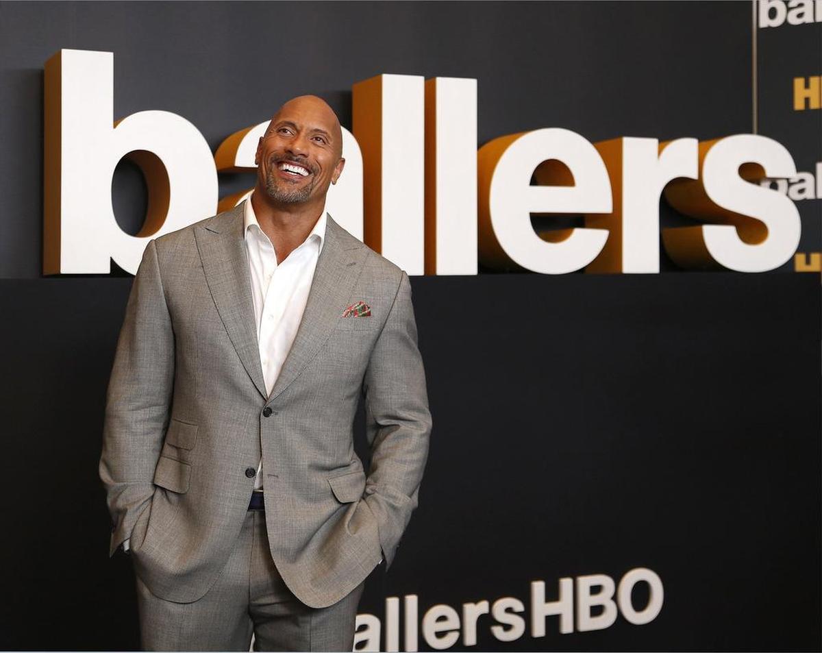Dwayne "the Rock" Johnson hits the "black carpet" on premiere night. On Thursday, July 14 2016 cast members of the HBO hit, Ballers, walked the "black carpet" for the second season premiere at the New World Symphony in Miami Beach, Florida.