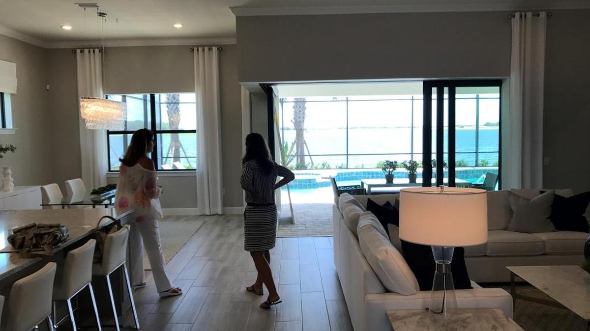 Visitors check out the Pinnacle model in Shoreview at Lakewood Ranch Waterside. The Pinnacle ranges in size from 2,488-3,656 square feet, and has a base price of $484,990.