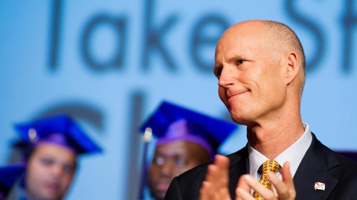 Gov. Rick Scott applauds as 55 Take Stock in Children graduates take the stage for their commencement ceremony at Marathon High School in Marathon, Fla. in the Florida Keys on Saturday, June 4, 2011.