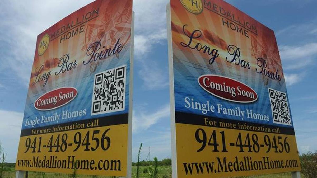 Signs mark the location of Long Bar Pointe on 75th Street West in Bradenton.