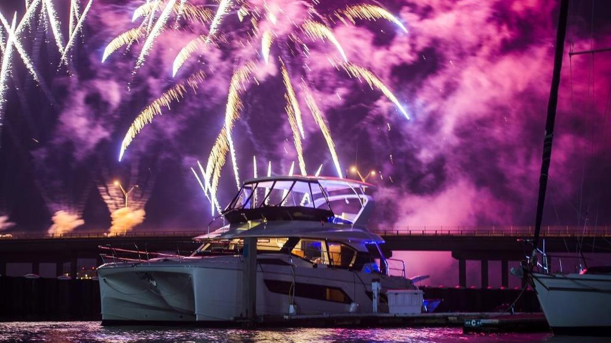 Fireworks explode in the distance behind a boat floating in Twin Dolphin Marina after the third annual Bradenton Area River Regatta on Saturday afternoon, February 4, 2017 on the Manatee River in Bradenton.