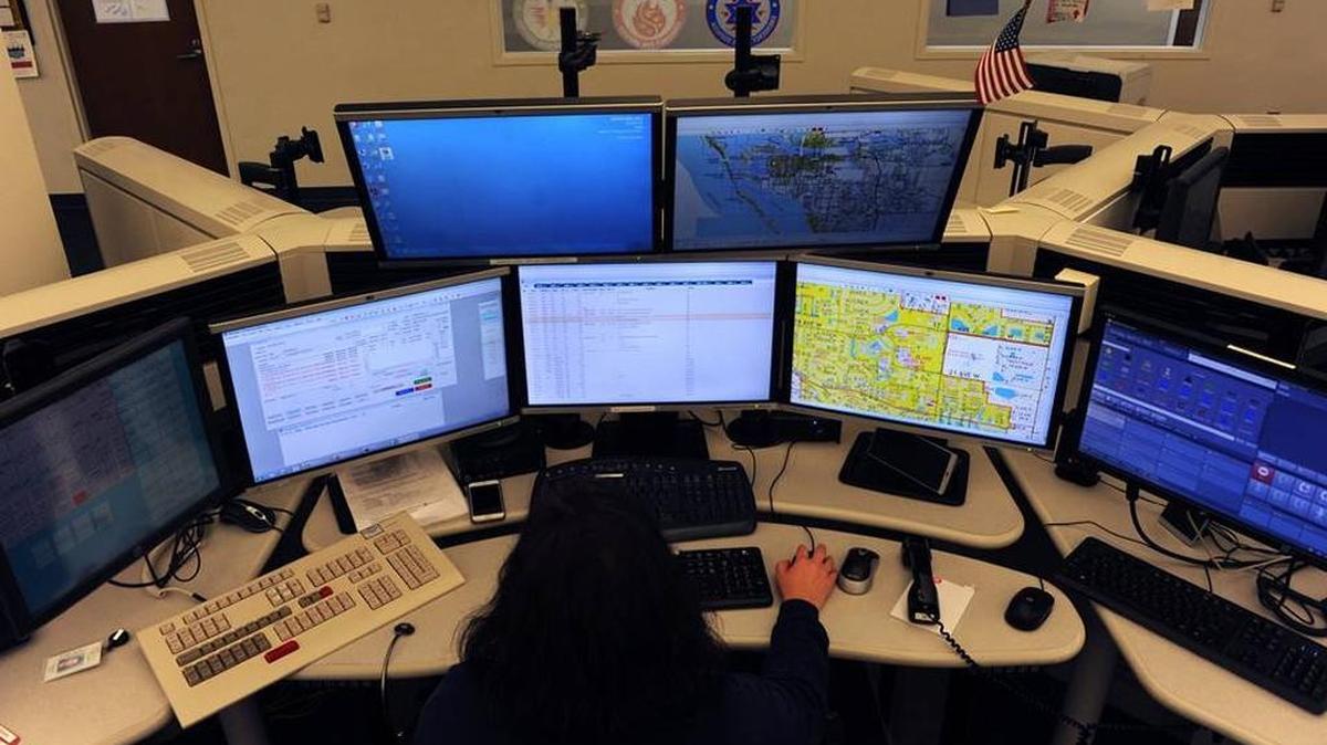 Dispatcher Tracey Haas keeps a watchful eye on multiple screens as she dispatches emergency responders through Manatee County’s 911 system in April 2016 at the Manatee County Emergency Communications Center.