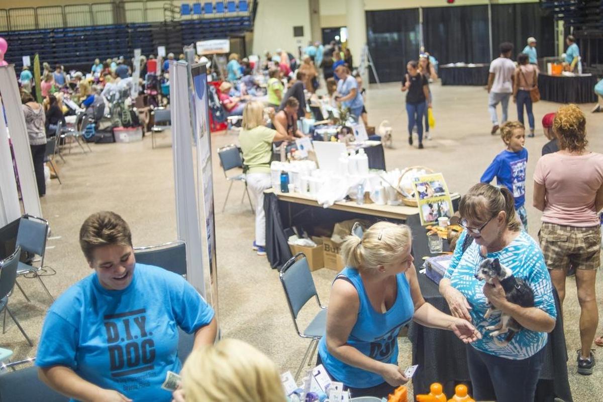 Vendors meet with adopters during the 2017 Adopt-A-Palooza event, hosted by Manatee County Animal Services at the Bradenton Area Convention Center in Palmetto. This year’s event will feature more than 100 pets up for adoption from local shelters and rescues.