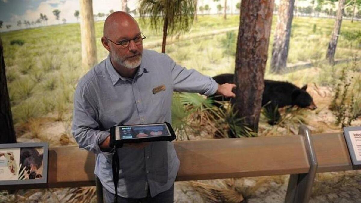 South Florida Museum Provost and Chief Operating Officer Jeff Rodgers shows off new interactive technology implemented last year. Expansion efforts are speeding up with the city deeding land to the museum in order to secure crucial funding for the expansion efforts.