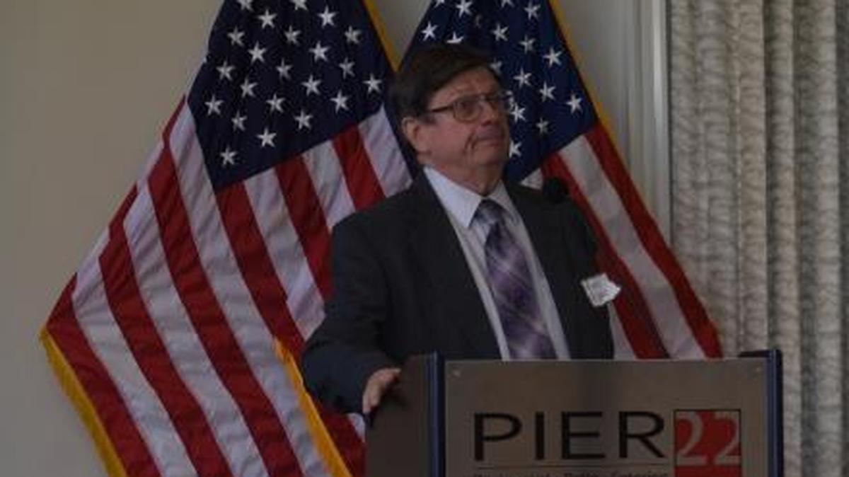 Kenneth Piper, left speaks to a crowd at Manatee Tiger Bay’s luncheon Thursday, alongside fellow panelist Laura Youmans.