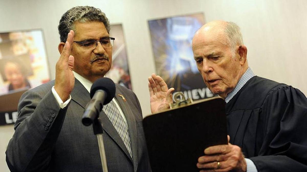 John Colon is sworn in to the Manatee County School Board by Judge Thomas Gallen before a school board meeting in September.