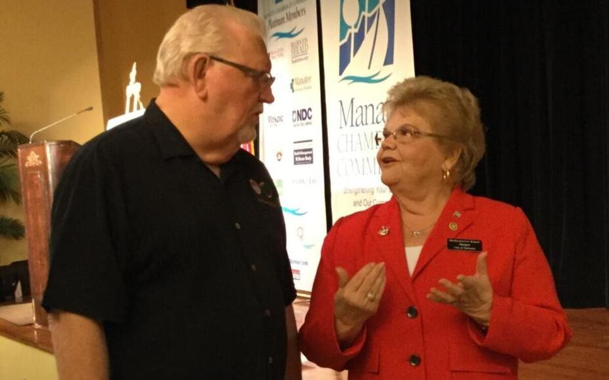 Bradenton Mayor Wayne Poston and Palmetto Mayor Shirley Groover Bryant share some thoughts with one another before presenting to the Manatee Chamber of Commerce on the current and future progress of the two cities.