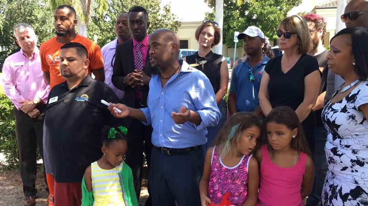Manatee County NAACP Chapter President Rodney Jones, center, in blue shirt, addresses a press conference held at the Bradenton Police Department on Oct. 9, 2016. The NAACP has put out several public records request in order to see if Manatee County minorities are stopped, searched, arrested and shot in disproportionate numbers.