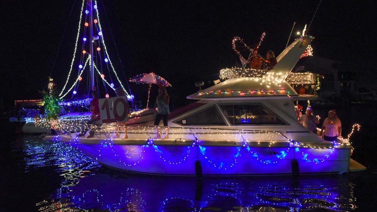 Decorated boats sail through the waters near the Bradenton Yacht Club in Palmetto for the 18th year of the holiday boat parade on Manatee River in 2015.