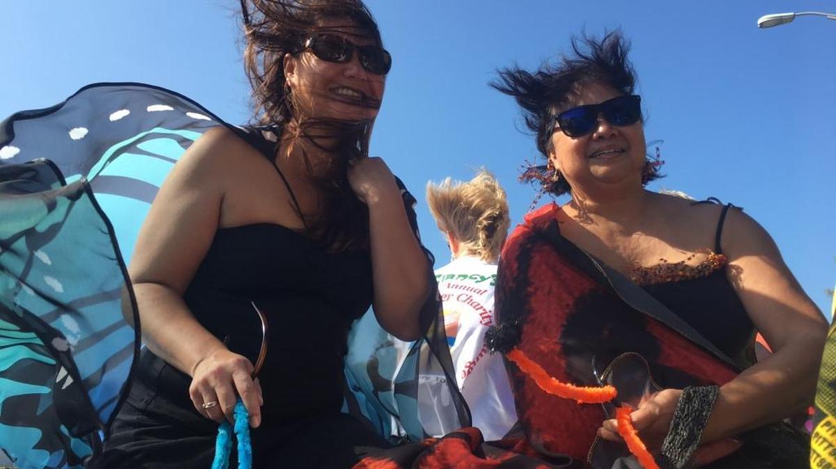 As Liza Goren, right, and her daughter know, riding on top of Mel Stowe's antique fire truck to Clancy's Irish Pub's 9th Annual Shamrock Shiver Charity Plunge in Bradenton Beach creates a crazy hair day.