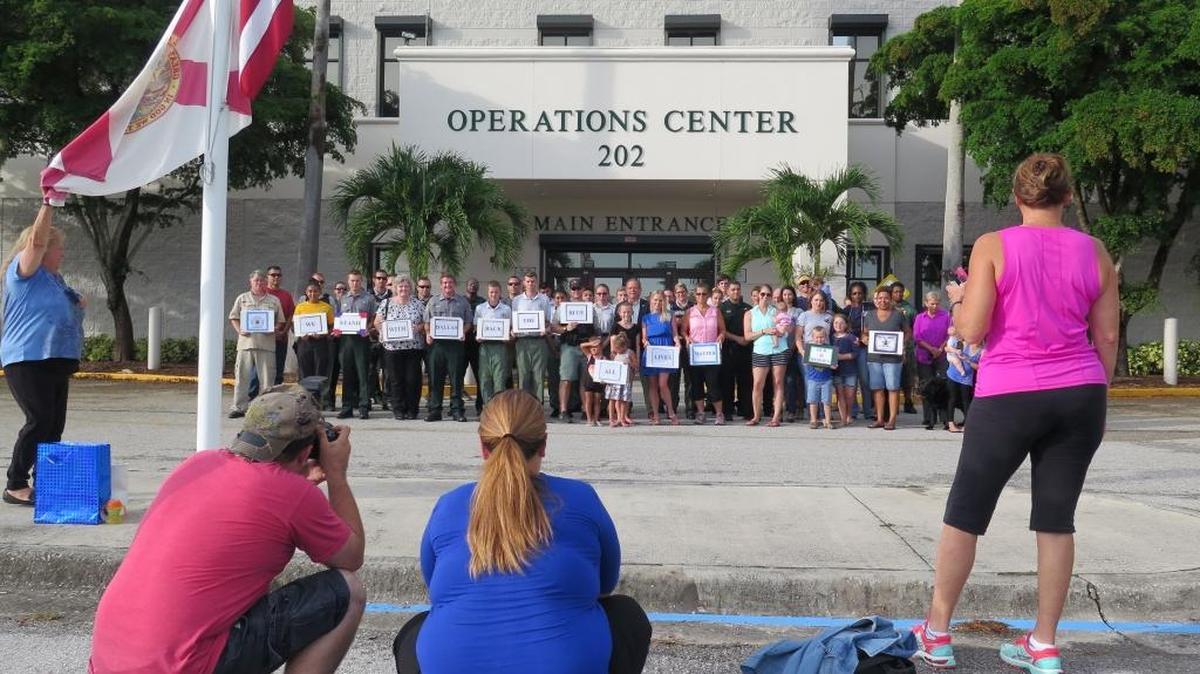 Local residents and volunteers pose with members of the Manatee County Sheriff’s Office Tuesday evening outside the agency’s Operations Center for a “Back the Blue” gathering hosted by the West Florida LEO Wives.