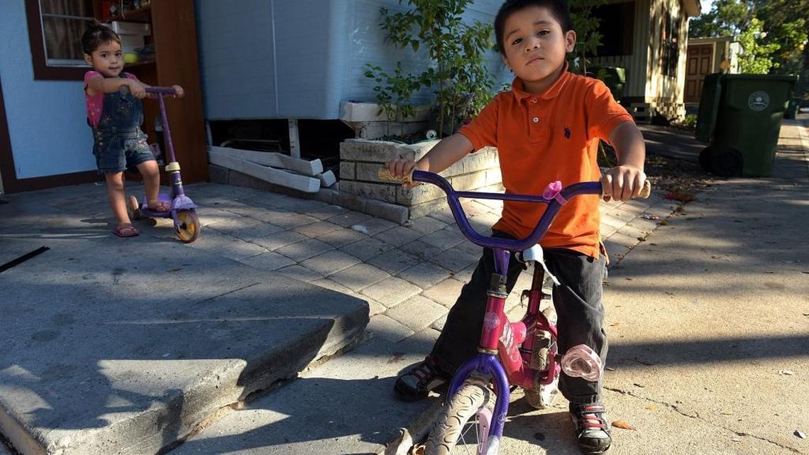 Oscar Garcia Luna, 5, on his bike with his little sister, Aisha, 2. Now that Donald Trump is president-elect of the United States, some children of undocumented immigrants in Manatee County express their fears associated with the future of their families.