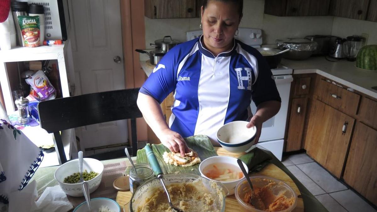Blanca Erazo, 42, prepares a tamale in her Bradenton home. Erazo is originally from Honduras and shared what the tamale tradition means to her and her family.