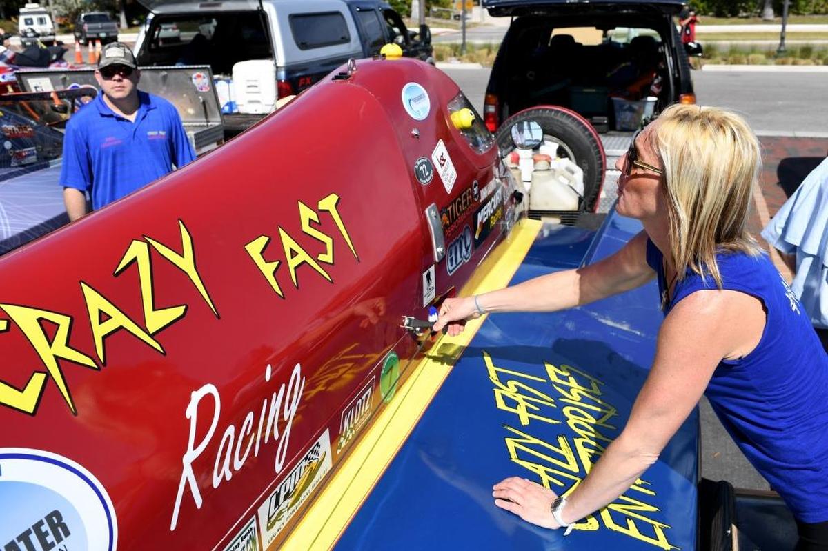 A crew works on a boat in Palmetto which was bustling as boats and jet skis unload in preparation for the Bradenton Area River Regatta Saturday.