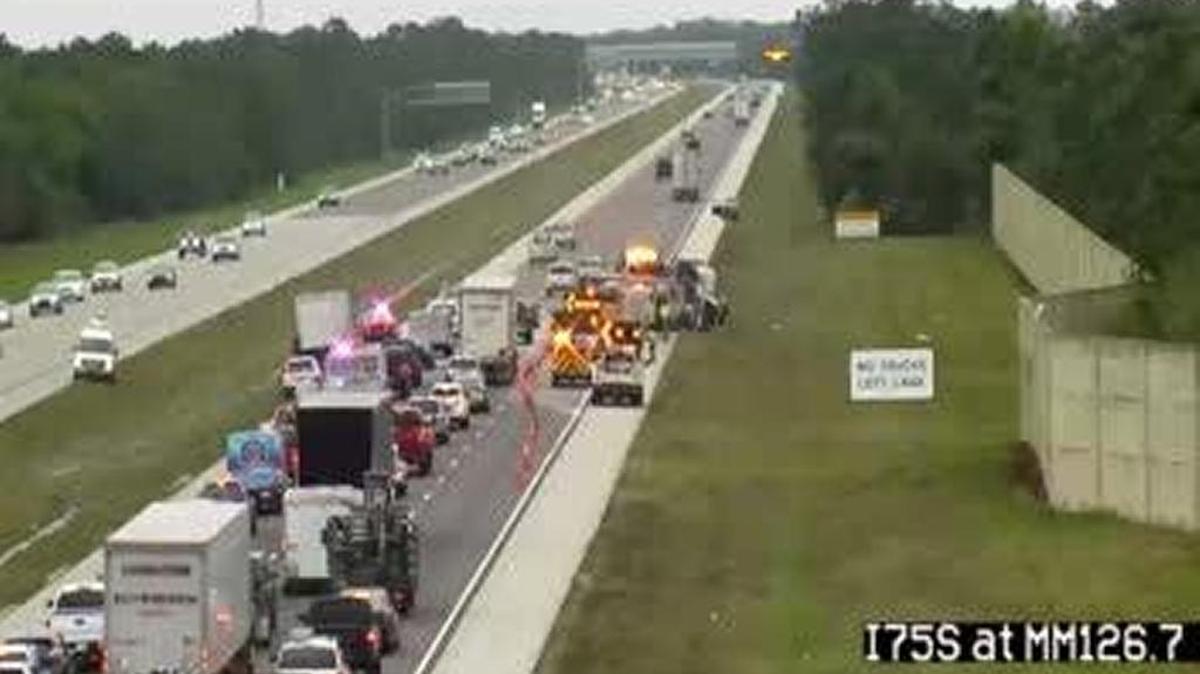 A crash is blocking all lanes of southbound Interstate 75 in Lee County Tuesday morning after a truck spilled gravel across the roadway.