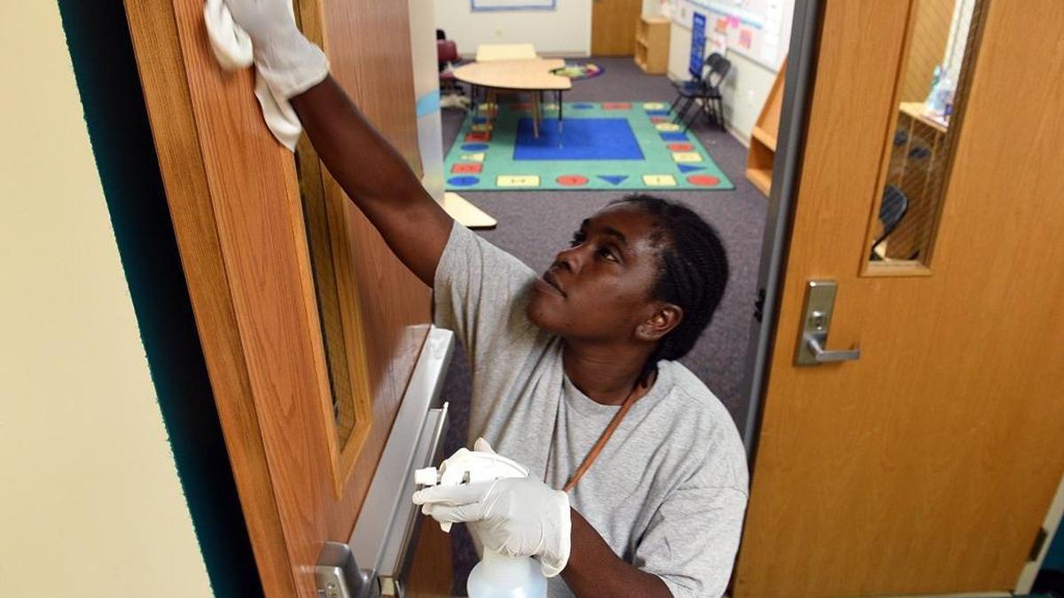Michelle Jordan cleans up at Prine Elementary, which was used as a shelter for evacuees Tuesday after Hurricane Irma.