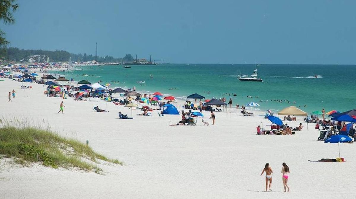 Beachgoers enjoy Anna Maria Island beaches in this Fourth of July weekend 2015 file photo.