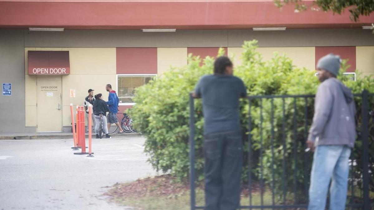 Residents wait to get service outside Turning Points homeless facility on Thursday morning, December 8, 2016 in Bradenton. Turning Points is an organization that facilitates help such as housing, medical care and other services to homeless and at-risk Manatee County residents.