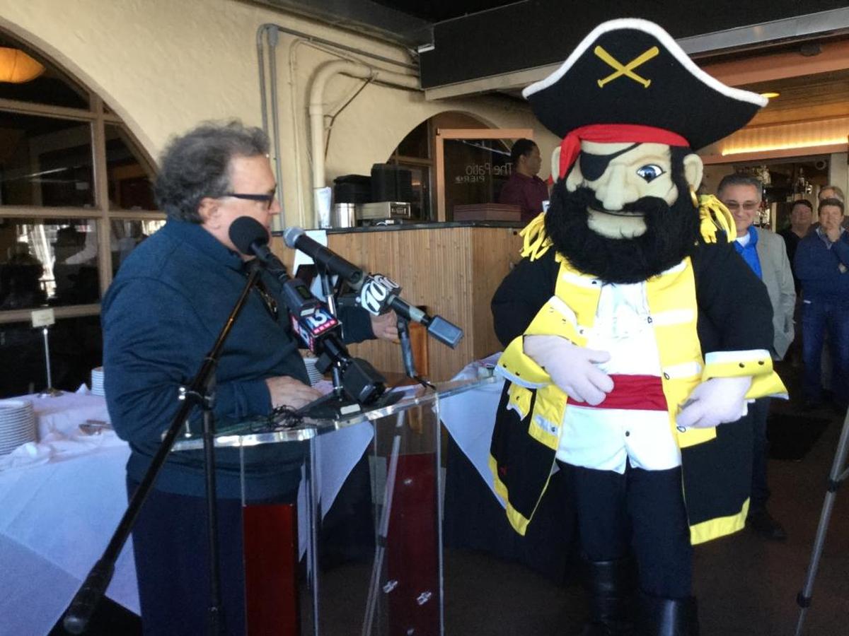 Mike Fetchko, ISM USA president and regatta organizer, has a little fun with Marty the Marauder at Thursday’s press conference at Pier 22 as the countdown to the 2018 Bradenton Area River Regatta begins.
