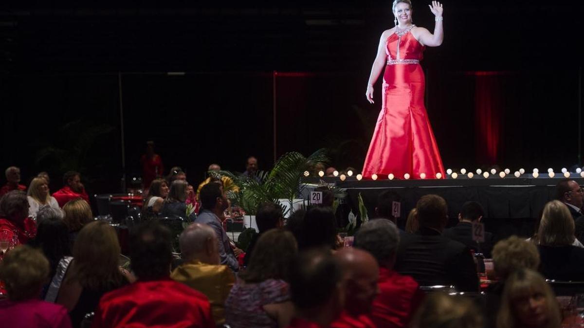 Christina Atkinson waves to the crowd as she walks down the runway during the Queen Selection Banquet for the Hernando de Soto Historical Society on Wednesday evening at the Bradenton Area Convention Center in Palmetto. The Hernando de Soto Historical Society is interviewing candidates for the 2017 Queen and Princess titles for the DeSoto Heritage Festival, asking them questions about their character and quizzing them on Hernando de Soto history.
