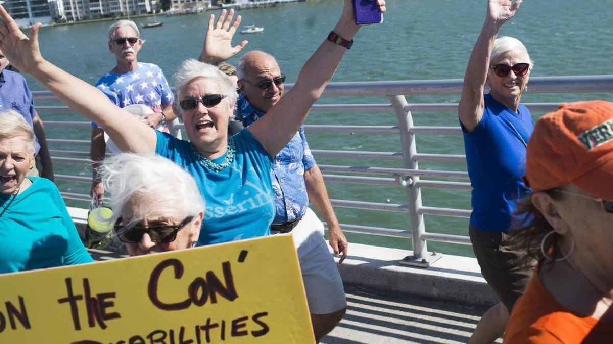 Thousands of protestors march as part of the Women’s March on Saturday afternoon in Sarasota. The mass of people crossed the John Ringling Causeway, chanting for reproductive rights, equal pay for women and other progressive issues.