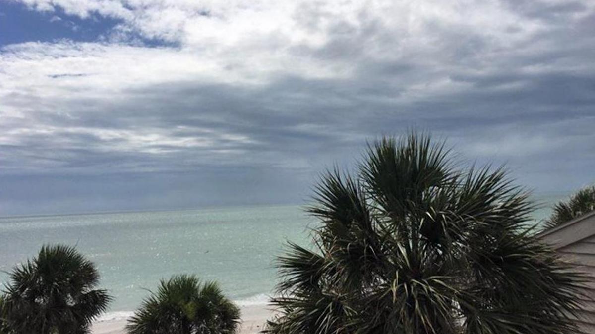 Dark clouds were seen over Belleair Beach on Saturday.