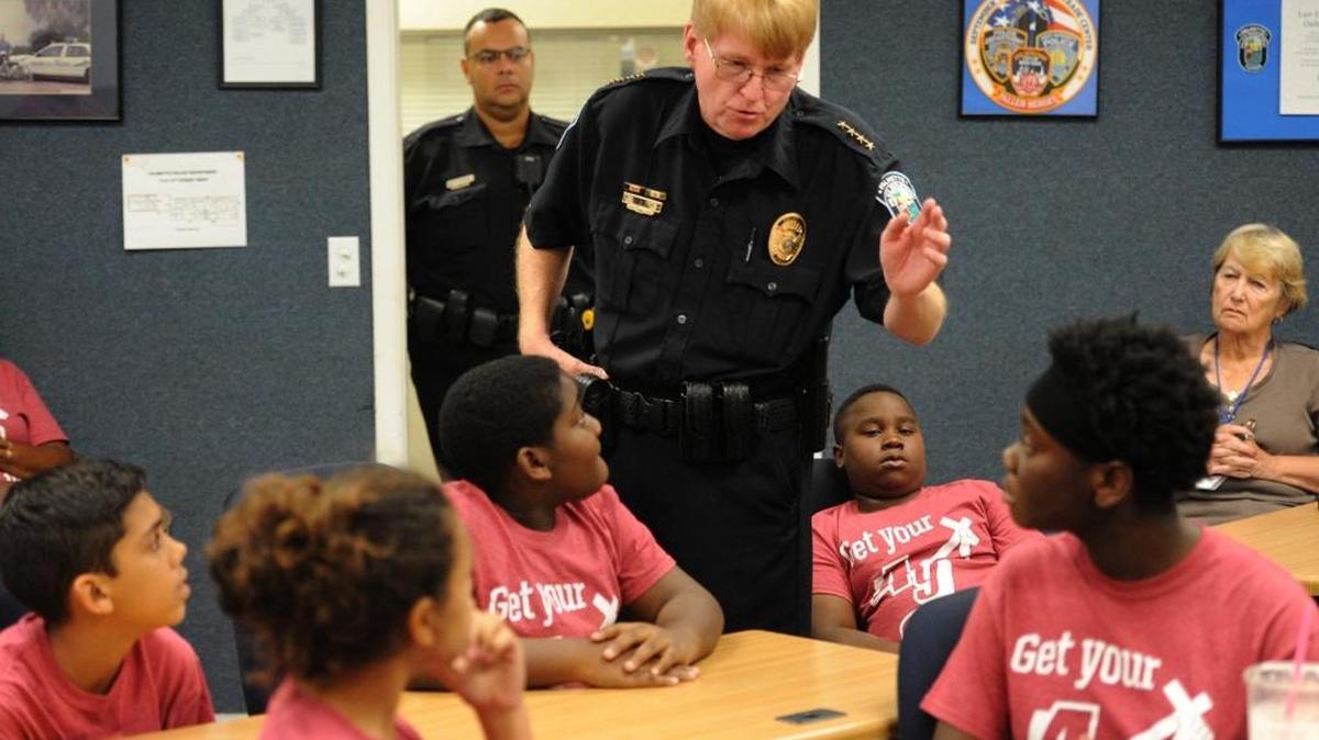 Chief Scott Tyler instructs youth with LightWay Ministries how to make a traffic stop during Palmetto Police Department's Youth Academy on Friday in Palmetto.