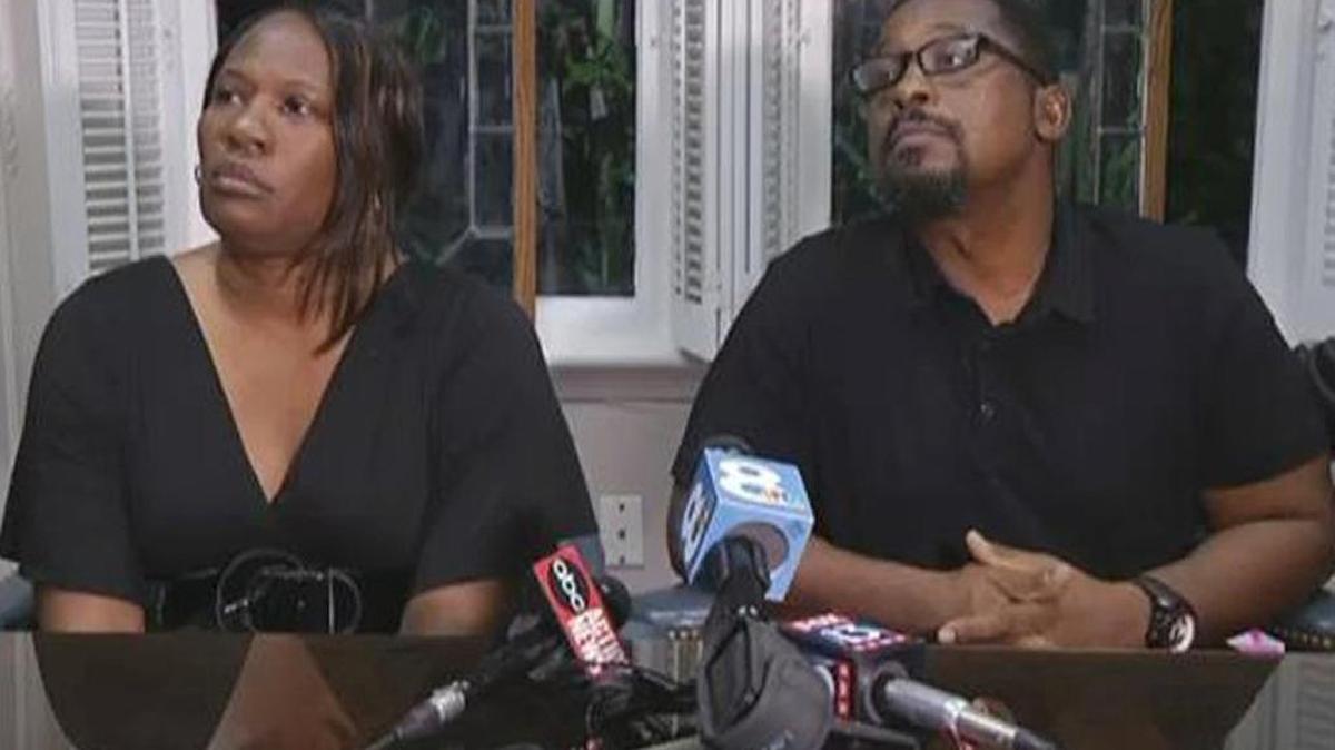 Rosita Donaldson and Howell Donaldson Jr., the parents of accused Seminole Heights killer Howell Donaldson III, answer questions from assembled media members at their attorney’s office on Friday.