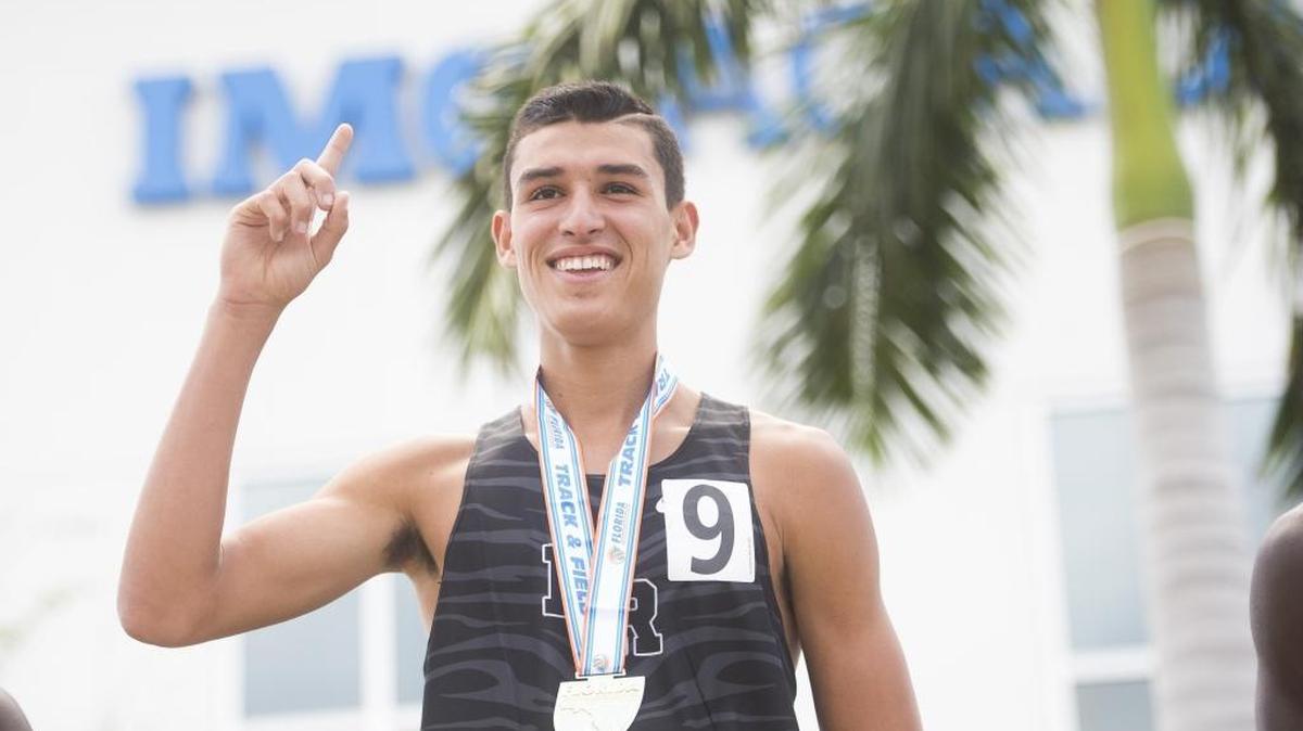Lakewood Ranch’s John Rivera holds up a single finger celebrating his victory in the 800 meter race during the first day of the FHSAA State Track and Field finals on Friday afternoon at IMG Academy in Bradenton.