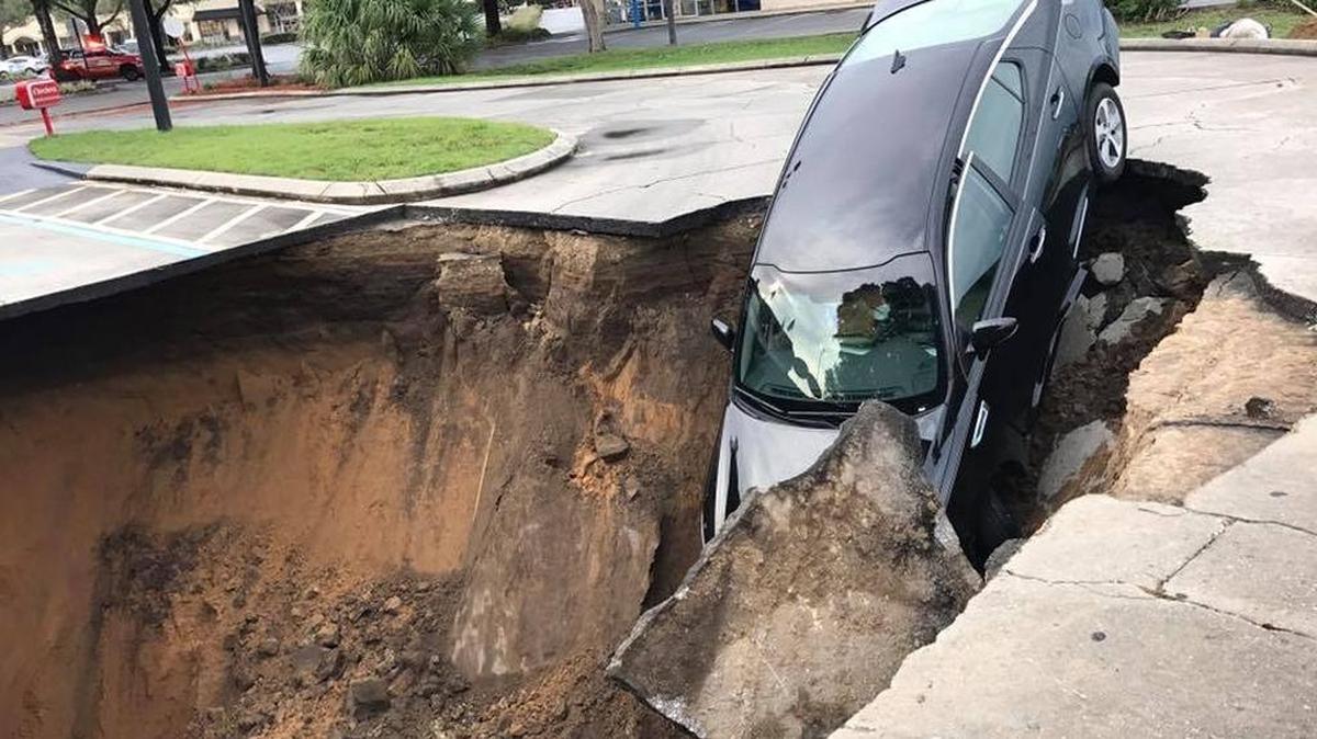 A car was swallowed by a sinkhole at an Ocala shopping complex on Saturday