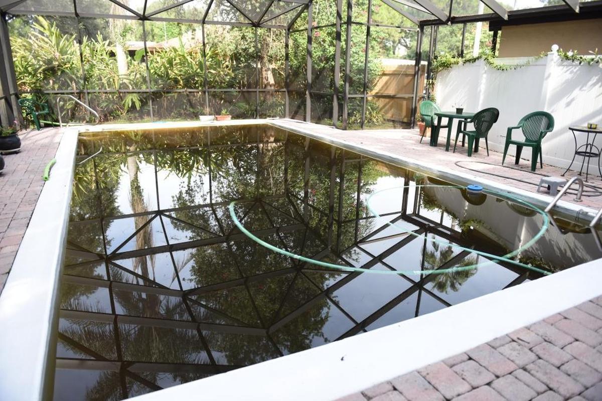 The pool at the Hundleys’ home on Ell Way was blackened by a flood that passed through on Aug. 26.