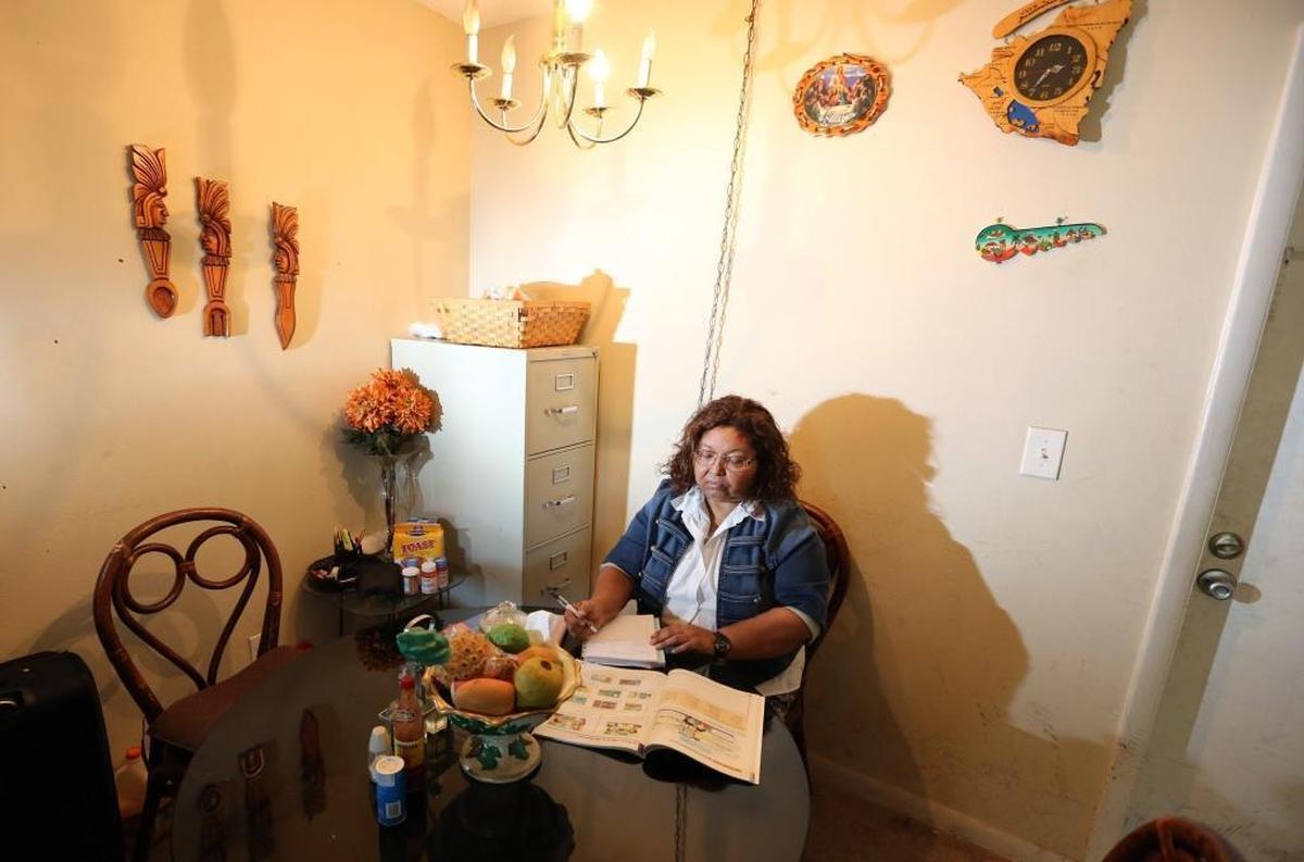 Maria Elena Hernandez, a 58-year-old immigrant from Nicaragua, works on English homework for a class she is taking, at the dining room table of an apartment in Plantation that she shares with her family. Hernandez has been living in South Florida legally for the past 19 years. The Trump administration has announced it is ending TPS for Nicaraguans like Hernandez. Their status now expires in January, 2019.