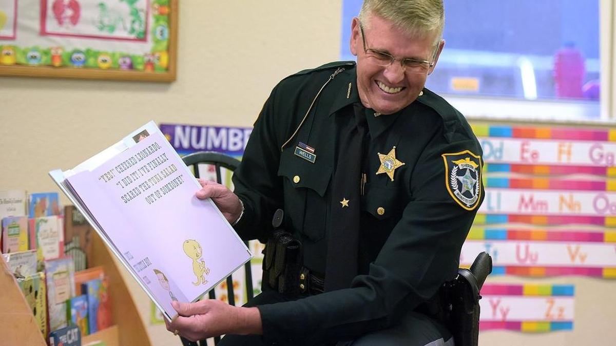 Sheriff-elect Rick Wells launches year two of the Early Learning Coalition of Manatee County’s Deputy Friendly program by reading a story to VPK and three year old students at Happy Cubs.