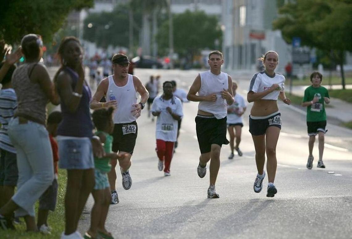 In this file photo, 5K runners near the finish line as onlookers cheer before the start of the DeSoto Grand Parade.