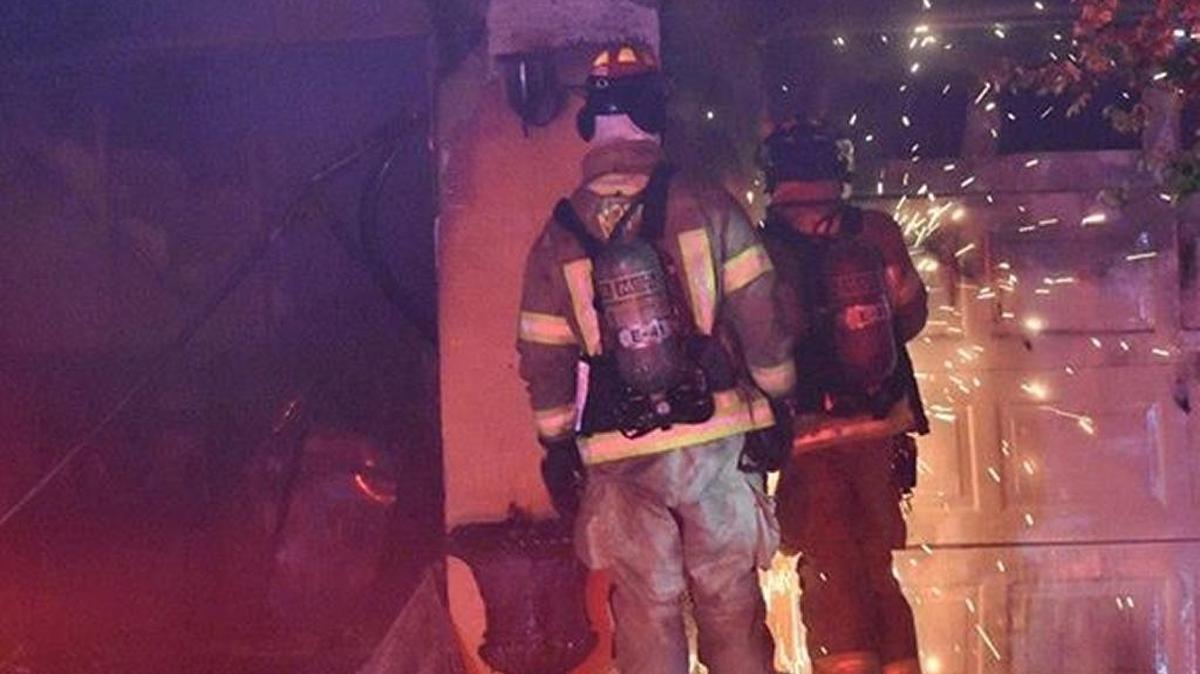 Firefighters work at the scene of a fire reported in the Regency Oaks subdivision in North Palmetto on Tuesday evening.
