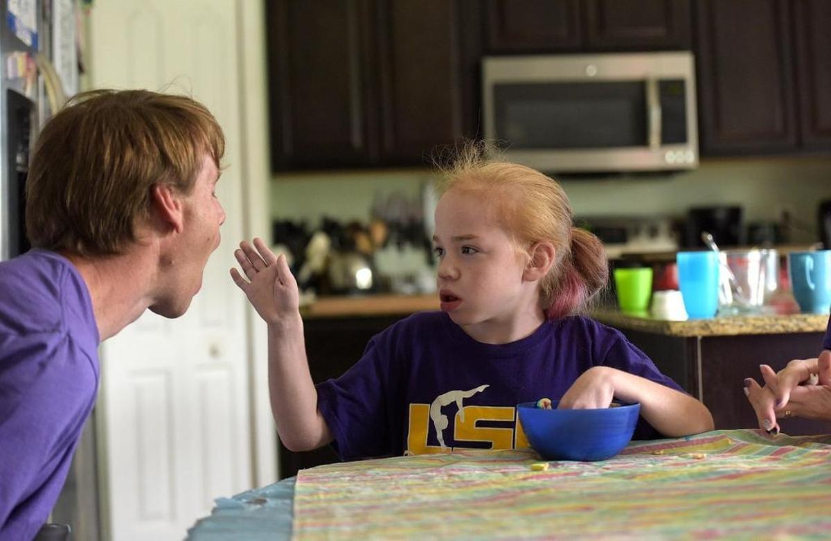 Randy Humphrey plays with his daughter, Fiona, who was diagnosed with Sanfilippo syndrome. The family struggled for a long time finding the right diagnosis.