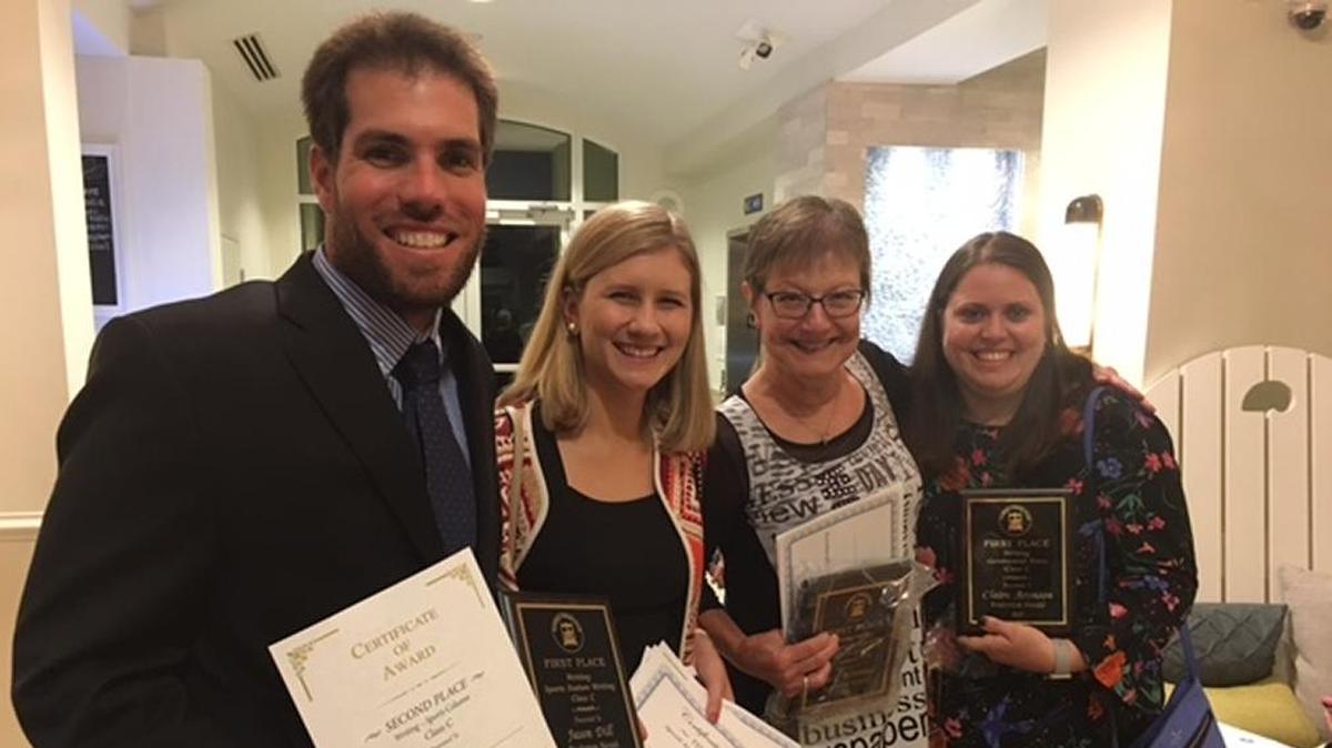 Herald reporters Jason Dill, Hannah Morse and former reporter Claire Aronson pose with Executive Editor Joan Krauter, second from right, after taking home awards at the 2017 Florida Press Club Excellence in Journalism Competition Saturday.