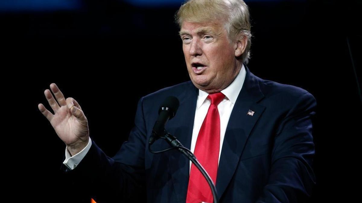 In this July 1, 2016, photo, Republican presidential candidate Donald Trump speaks during the opening session of the Western Conservative Summit in Denver.